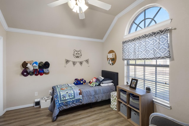 bedroom featuring multiple windows, crown molding, and wood-type flooring