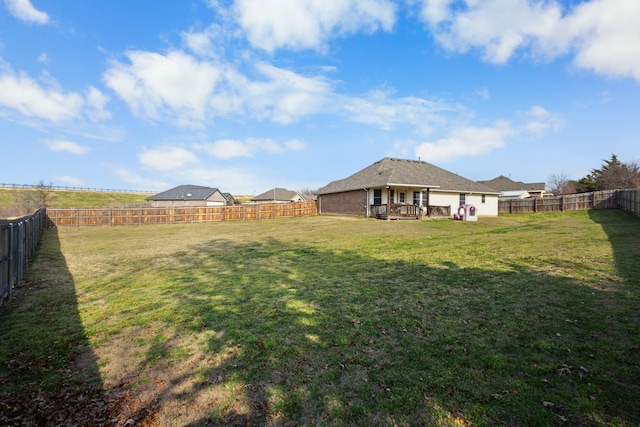 view of yard with a wooden deck