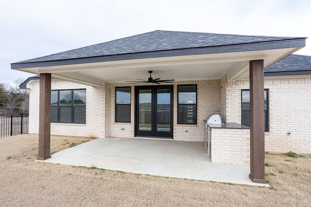 exterior space with ceiling fan, exterior kitchen, and a patio