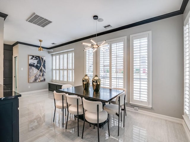 dining room with crown molding