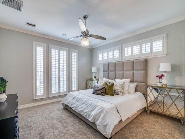 bedroom with ceiling fan, ornamental molding, and carpet flooring