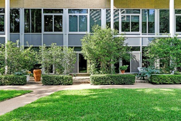 entrance to property featuring a yard