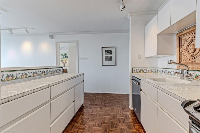 kitchen featuring tile countertops, dishwasher, sink, white cabinets, and dark parquet flooring