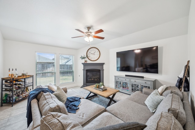 tiled living room featuring ceiling fan