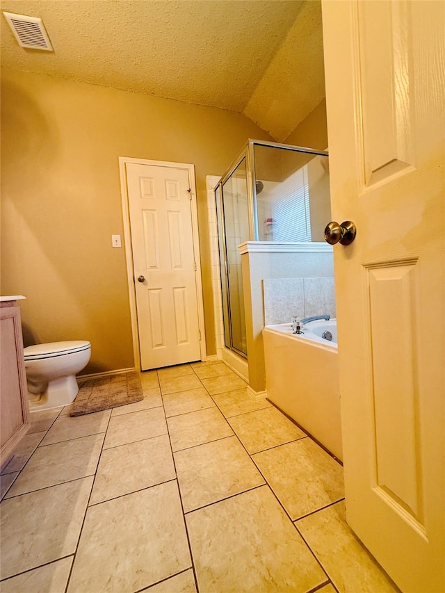 full bathroom with tile patterned flooring, vanity, a textured ceiling, shower with separate bathtub, and toilet