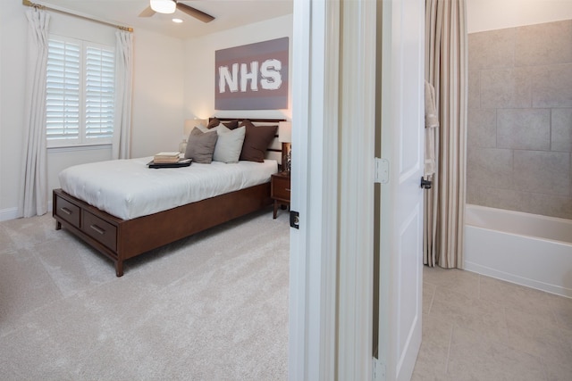 bedroom featuring light tile patterned floors and ceiling fan