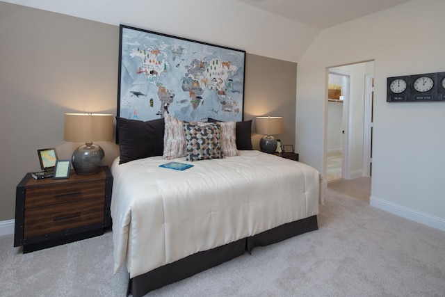 carpeted bedroom featuring lofted ceiling