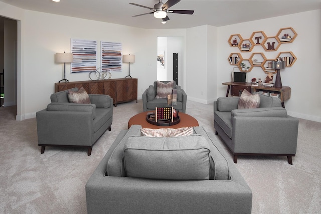 living room featuring carpet and ceiling fan