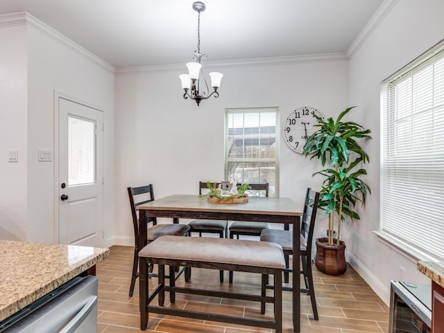 dining room featuring crown molding and a chandelier