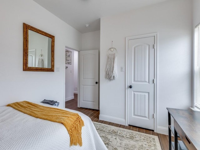 bedroom featuring dark wood-type flooring