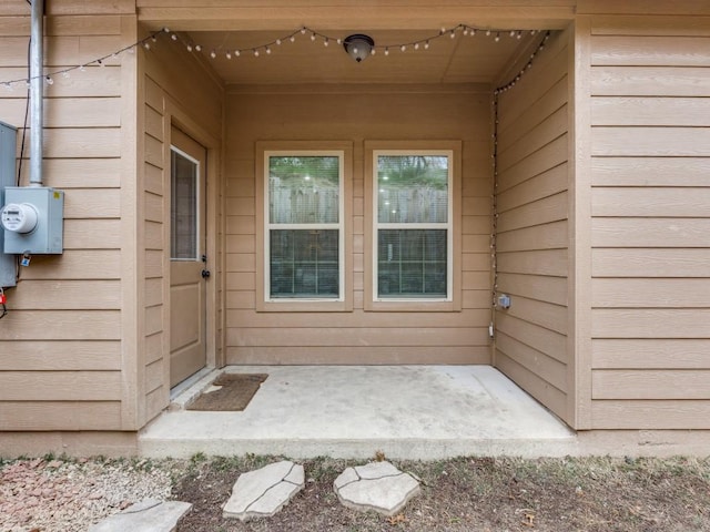 property entrance with a patio area