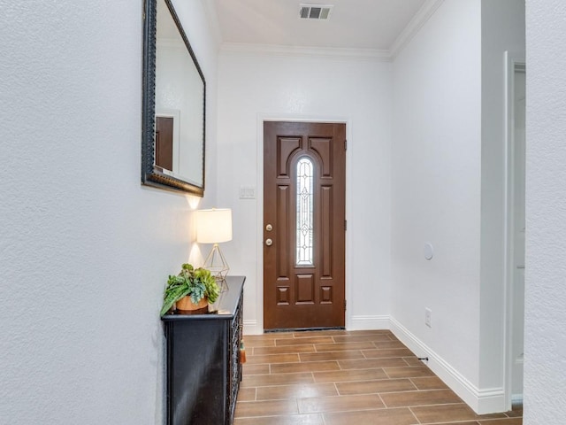 entrance foyer featuring crown molding