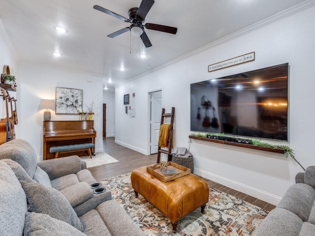 living room featuring crown molding, wood-type flooring, and ceiling fan