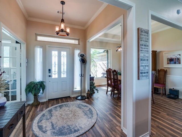 entryway with ornamental molding and dark wood-type flooring