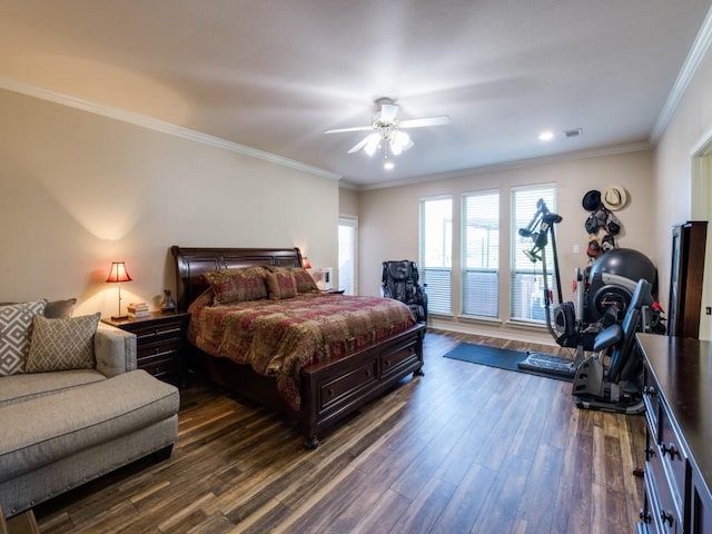 bedroom with crown molding, dark hardwood / wood-style floors, and ceiling fan