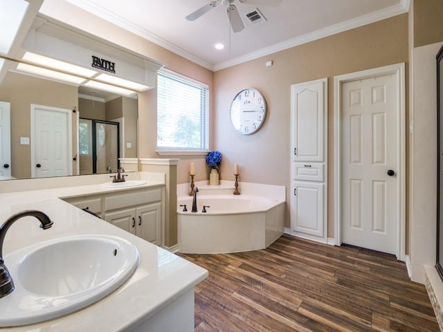 bathroom with hardwood / wood-style floors, vanity, plus walk in shower, crown molding, and ceiling fan