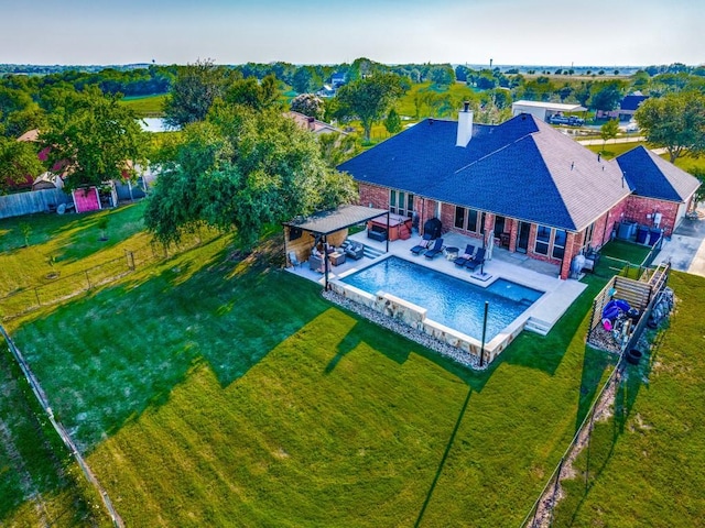 exterior space featuring a lawn and a patio area