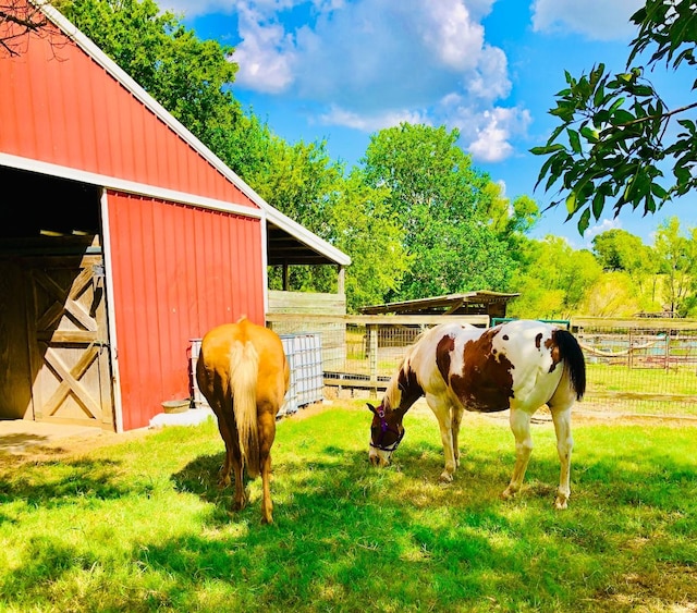 view of stable featuring a rural view