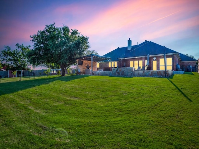 exterior space with a yard and a pergola