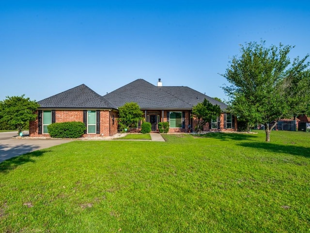 single story home with a front yard