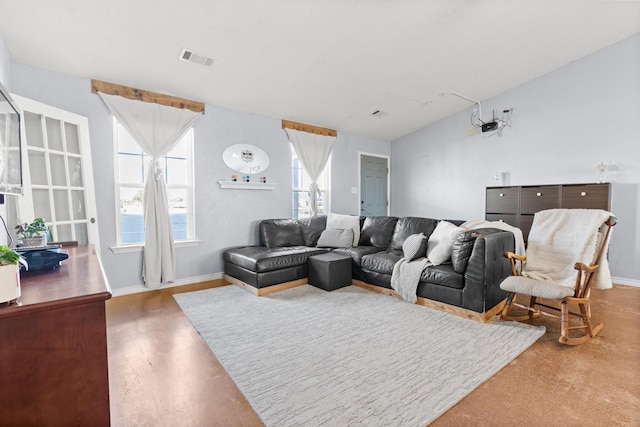 living room with hardwood / wood-style flooring and vaulted ceiling