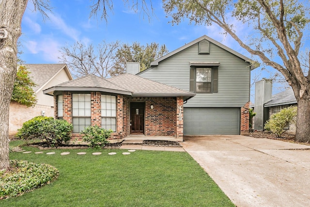 view of front of house with a garage and a front yard