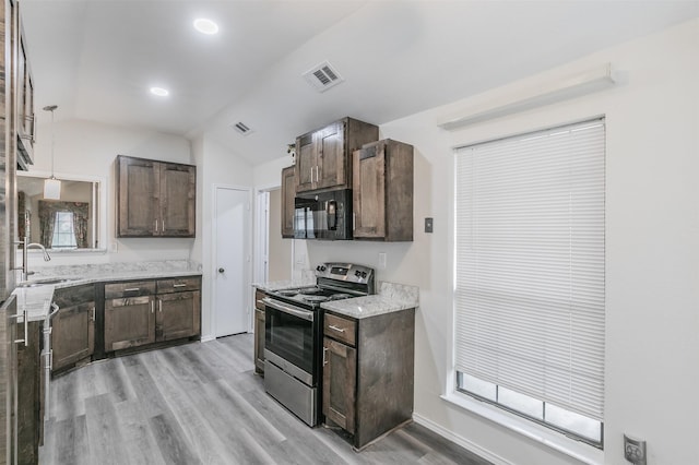 kitchen with light hardwood / wood-style flooring, sink, stainless steel electric stove, and lofted ceiling