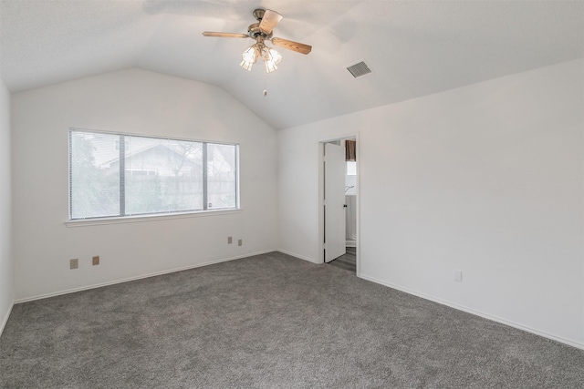 carpeted empty room with lofted ceiling and ceiling fan