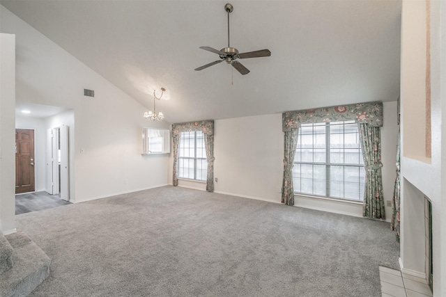 unfurnished living room with light carpet, ceiling fan with notable chandelier, and high vaulted ceiling