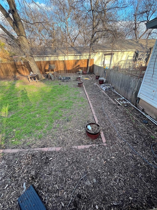 view of yard featuring a fenced backyard