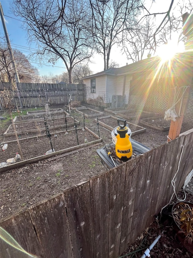 view of yard featuring a vegetable garden and fence