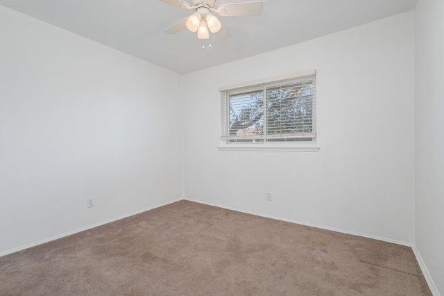 empty room featuring carpet and ceiling fan