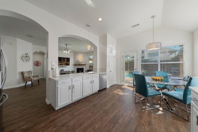 kitchen featuring white cabinetry, sink, stainless steel dishwasher, and pendant lighting