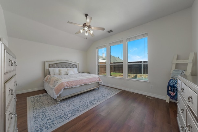 bedroom featuring dark wood-type flooring, ceiling fan, and vaulted ceiling