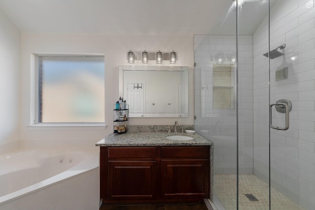 bathroom with vanity and plus walk in shower