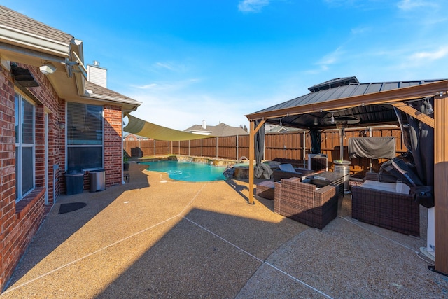 view of pool with a gazebo, outdoor lounge area, and a patio