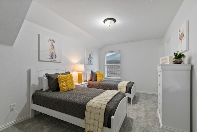 carpeted bedroom with vaulted ceiling