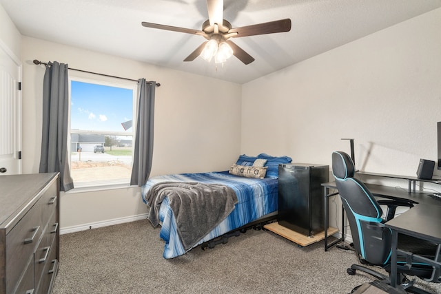 bedroom featuring carpet, a ceiling fan, and baseboards