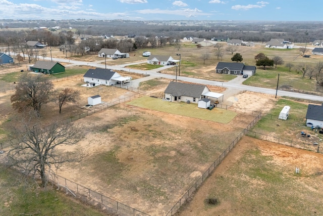 birds eye view of property with a rural view