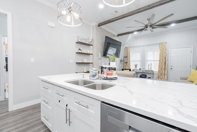 kitchen with white cabinetry, sink, hanging light fixtures, stainless steel dishwasher, and crown molding