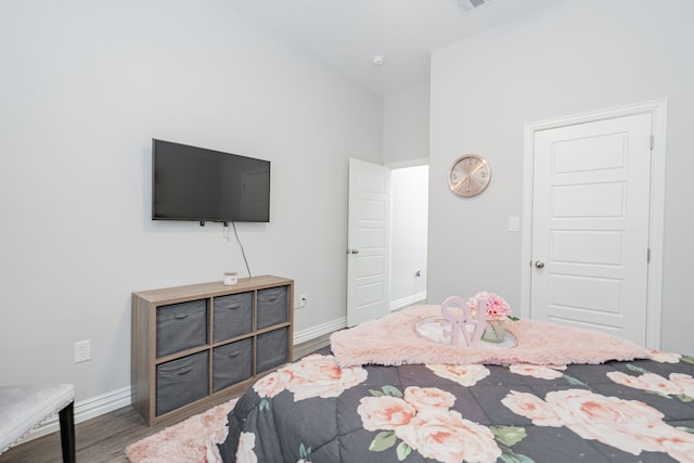 bedroom with hardwood / wood-style floors