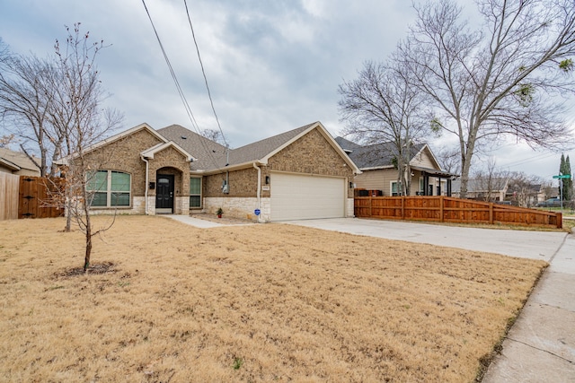 view of front of house with a garage and a front lawn