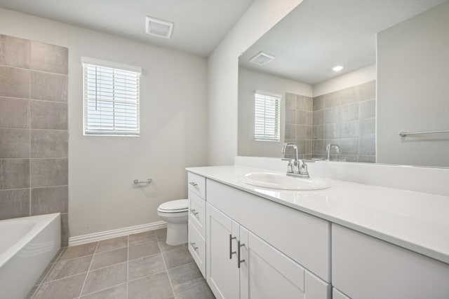 bathroom with tile patterned floors, toilet, and vanity