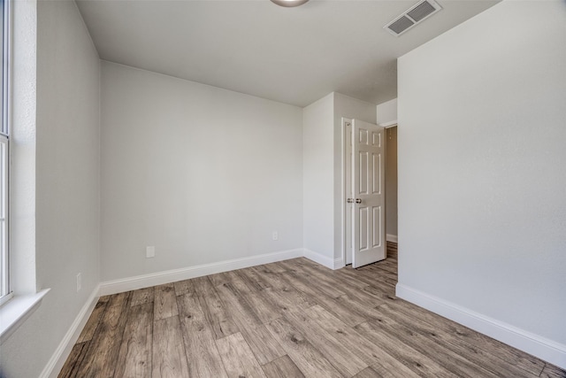 spare room with light wood-type flooring