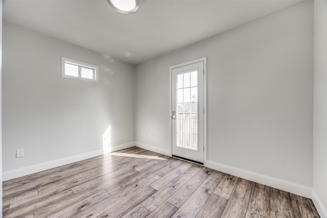 unfurnished room featuring light hardwood / wood-style floors