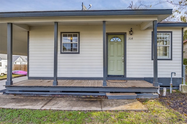 entrance to property with a deck