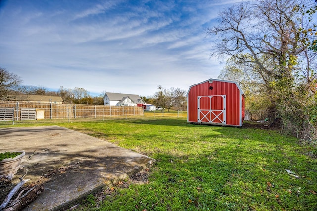 view of yard featuring a patio and a storage unit