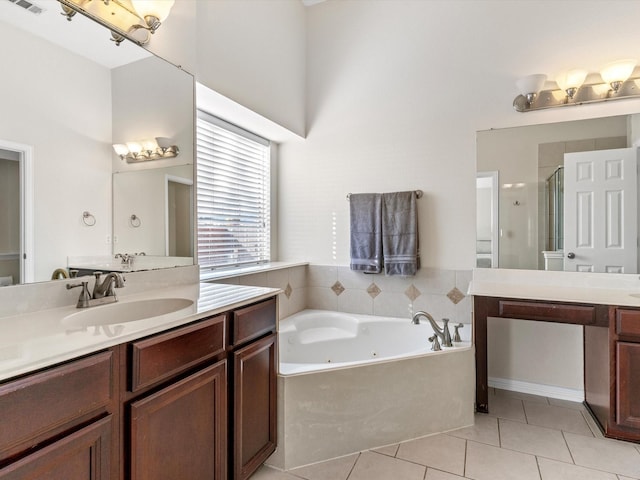 bathroom featuring shower with separate bathtub, tile patterned floors, and vanity