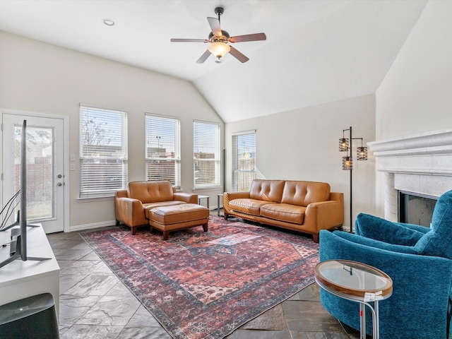 living room with ceiling fan and lofted ceiling