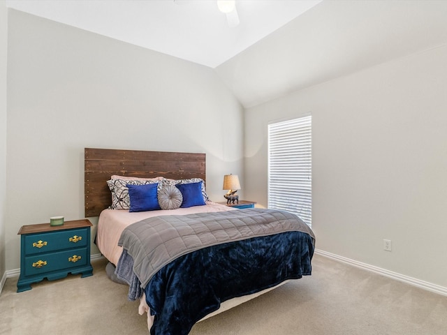 carpeted bedroom featuring lofted ceiling and ceiling fan